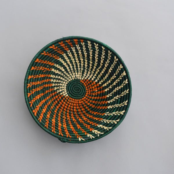 Hand woven straw. A tradition and art which has been part of Ugandan culture for centuries.  With all of the materials used being natural products or recycled, we also believe this is a lovely way of making use of natural resources the world has to offer and making positive changes to become more sustainable.  Beautifully, unique, handmade basket made out of banana stalks and raffia fibres also known as the Ugandan basket. 