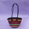 This carefully hand-woven straw handbag with leather handles is made of Elephant straw in Bolga, Ghana. Not only is it colorful, stylish but it is also 100% eco-friendly and practical. It is also, incredibly flexible and durable.  Perfect for carrying your everyday necessities. It has a leather toggle closure to keep items in the bag safe. Each bag is handmade, uniquely designed and dyed. None of them are the same nor the perfect machine look. 