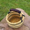 Small Round Straw basket I African Basket  This African straw basket also called Bolga basket is handwoven from elephant grass and dyed. It makes a great eco-friendly decorative bag, hamper basket, or storage basket.