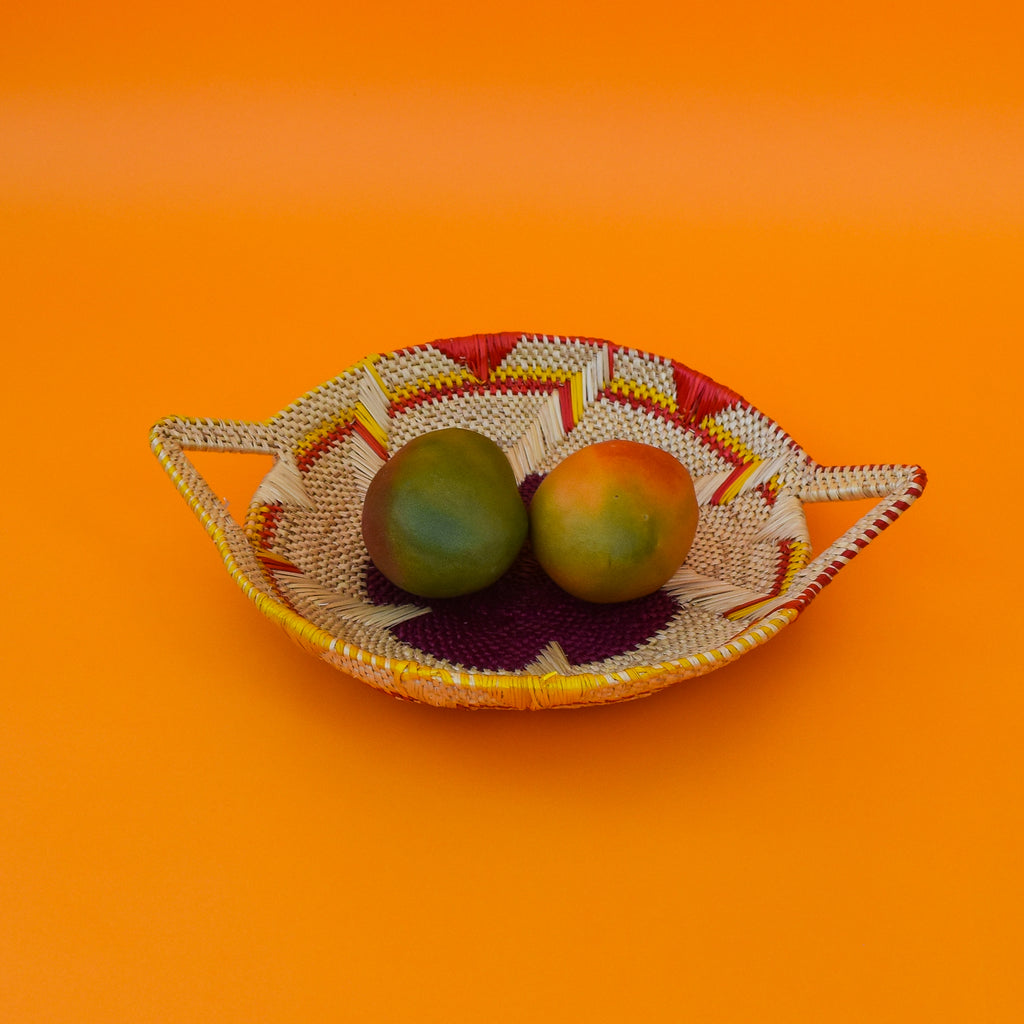 This carefully hand-woven fruit baskets is made of Elephant straw. No basket is the same, each piece has been handcrafted in Bolga, Ghana. There may be some imperfections but that is due to the fact that they are handmade.  Not only is it straw basket or bowl great for storing your fruit and vegetables, It can be used for quiet a number of things including storing bits & bobs and decorating. A stylish way to keep clutter away in the house.  It is 100% eco-friendly and practical and versatile.
