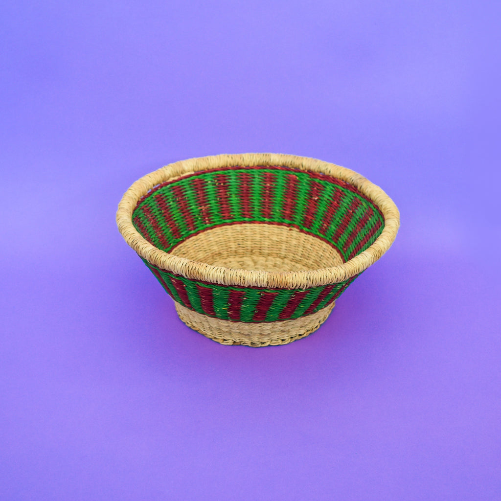 Multifunctional fruit basket for storing and decorating. This carefully hand-woven fruit baskets is made of Elephant straw. No basket is the same, each piece has been handcrafted in Bolga, Ghana. There may be some imperfections but that is due to the fact that they are handmade.  Not only is it straw basket or bowl great for storing your fruit and vegetables, It can be used for quiet a number of things including storing bits & bobs and decorating. A stylish way to keep clutter away in the house.