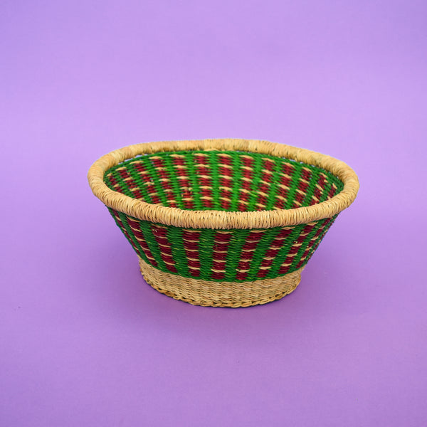 Multifunctional fruit basket for storing and decorating. This carefully hand-woven fruit baskets is made of Elephant straw. No basket is the same, each piece has been handcrafted in Bolga, Ghana. There may be some imperfections but that is due to the fact that they are handmade.  Not only is it straw basket or bowl great for storing your fruit and vegetables, It can be used for quiet a number of things including storing bits & bobs and decorating. A stylish way to keep clutter away in the house.