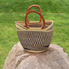 This market basket also called Bolga basket or U shopper is handwoven from elephant grass, leather, and dyed. It makes a great eco-friendly shopping bag, beach bag, or storage basket.   One great thing about this basket is, it’s sustainable. It is durable, soft, and can be used as many times as you wish and for multiple things, you can think of. Thus going grocery shopping, to the beach, a picnic, or even storing things in it. It will make a great present as well.